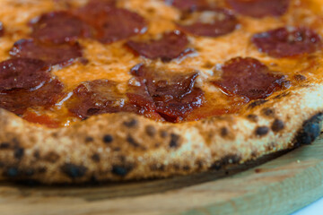 Pizza with salami and prosciutto. Meat pizza with cheese