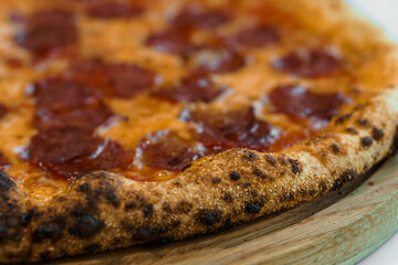 Pizza with salami and prosciutto. Meat pizza with cheese