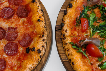 Pizza with salami and prosciutto. Meat pizza with cheese