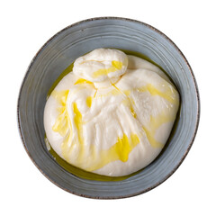 Burrata cheese with olive oil in gray bowl isolated on white background. Top view.