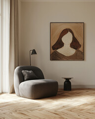Beige armchair near accent side table against stucco wall with big poster frame. Minimalist interior design of modern living room.