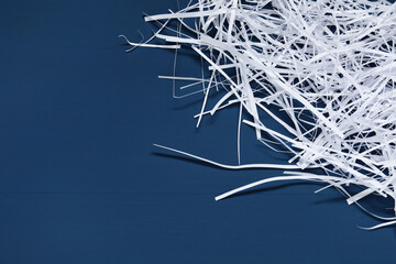Paper strips on blue wooden table, top view. Space for text