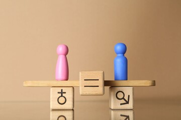 Gender equality concept. Cube with equals sign between male and female figures on scales against...