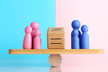 Gender equality concept. Cube with equals sign between male and female figures on scales against...