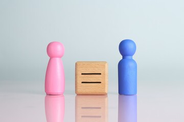 Gender equality concept. Male and female figures on light background