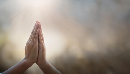 close-up image of hands clasped together in prayer, symbolizing deep faith and devotion in religion. The blurred background emphasizes the spiritual focus and connection to God, evoking a sense of tra