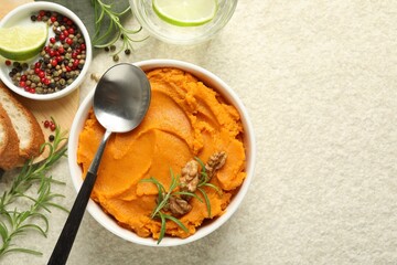 Delicious mashed sweet potatoes served on light table, top view. Space for text