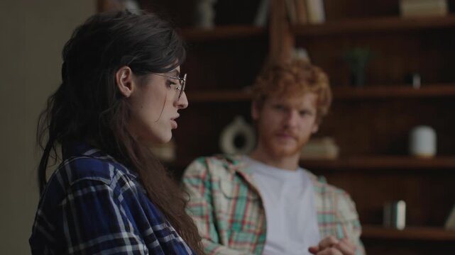 wife speaks honestly during a difficult family therapy session, addressing challenging issues in a moment of open communication and emotional vulnerability
