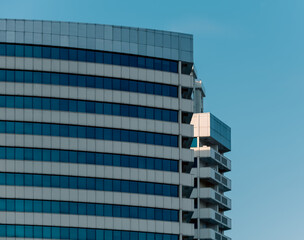 many windows and walls facade of a modern skyscraper without people