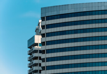 many windows and walls facade of a modern skyscraper without people