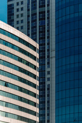 many windows and walls facade of a modern skyscraper without people