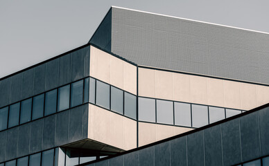 Fototapeta premium tall large gray concrete building with empty windows