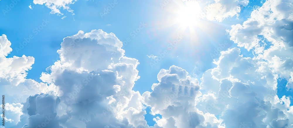 Poster sunny summer sky with fluffy white clouds and ample copy space image available