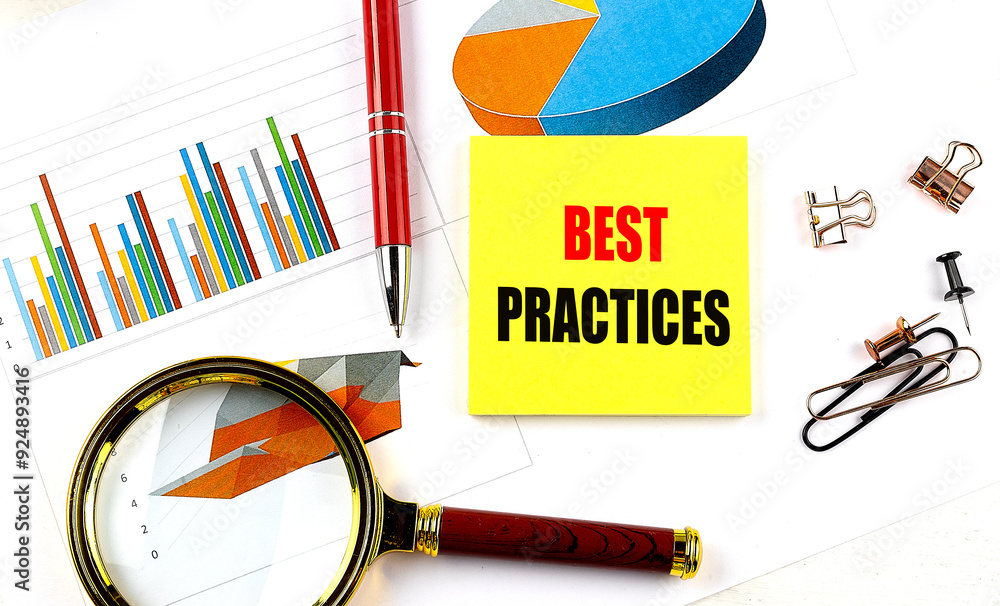 Poster best practices text on yellow sticky on chart with magnifier and pen