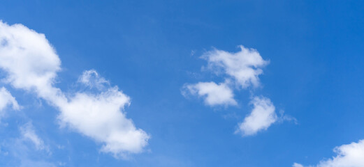 Beautiful blue sky with strange shape of clouds in the morning or evening used as natural background texture in decorative art work