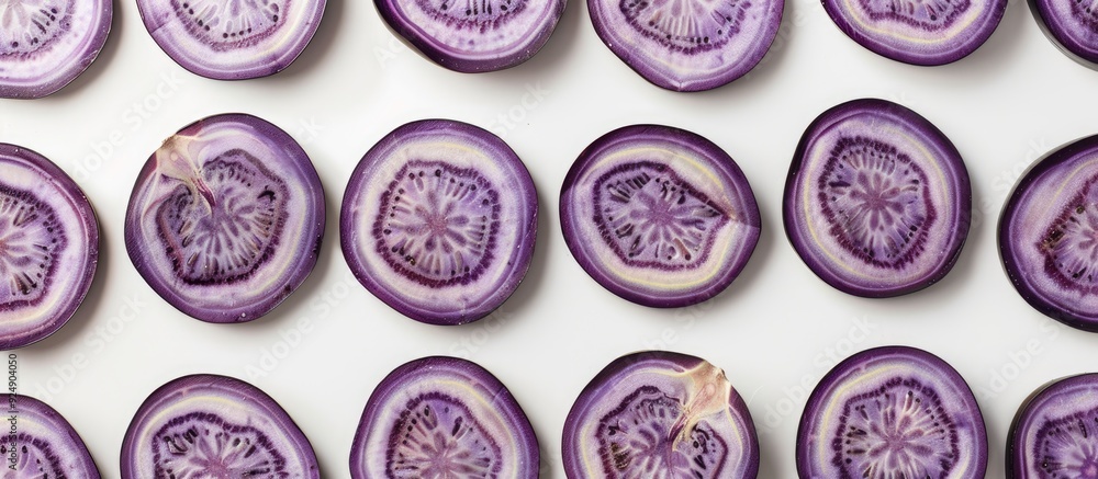 Poster Eggplant slices arranged in circular pattern on white backdrop Isolated with copy space image for decorative frame or border on a food themed background