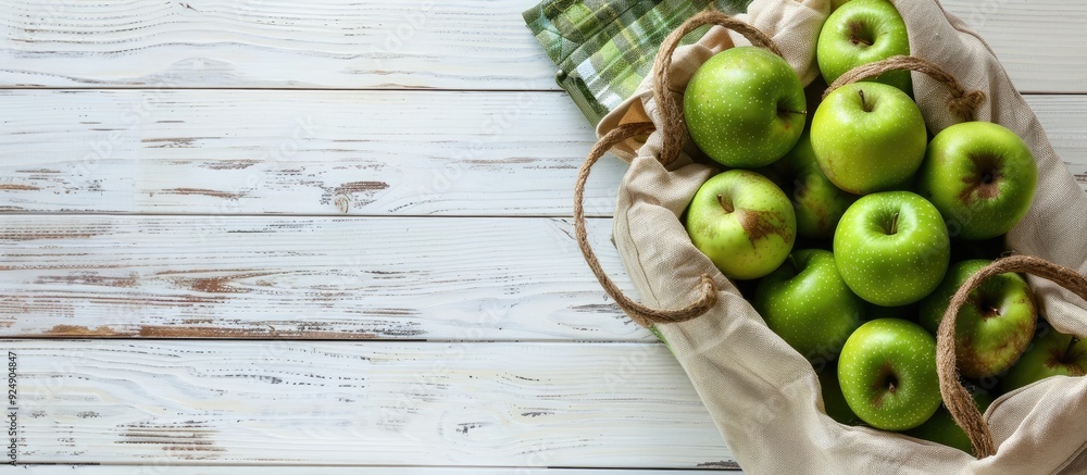 Aufkleber eco friendly bag with green apples on white wooden backdrop showcasing sustainable living with zero 