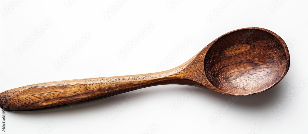 Poster Isolated on a white backdrop a wooden spoon is displayed with ample copy space image