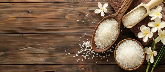 Spa treatment scene featuring white sea salt on a wooden backdrop with copy space image available for text placement
