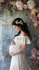 Pregnant woman wearing flower crown holding belly