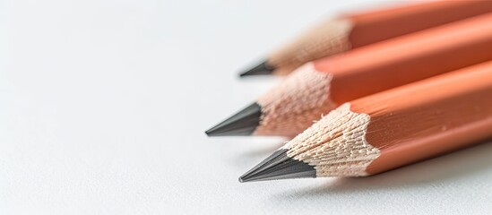 Obraz premium Fresh blurred pencils against a white backdrop with ample copy space image
