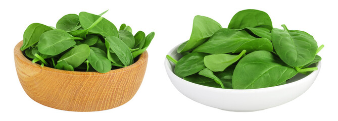 Baby spinach leaves in wooden bowl isolated on white background