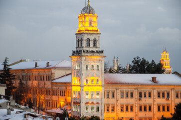 Fototapeta premium Selimiye Barracks illuminated on a snowy winter day, Istanbul, Turkey 
