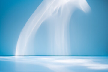 Abstract blue background for product presentation with sunlight and blurred shadows wall. Winter...
