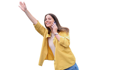 Beautiful, young woman standing on the street, talking on mobile phone and calling a taxi	

