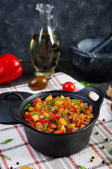 Stewed vegetables with tomato sauce and herbs. Spicy vegetable stew