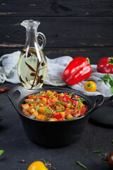 Stewed vegetables with tomato sauce and herbs. Spicy vegetable stew
