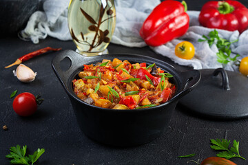 Stewed vegetables with tomato sauce and herbs. Spicy vegetable stew