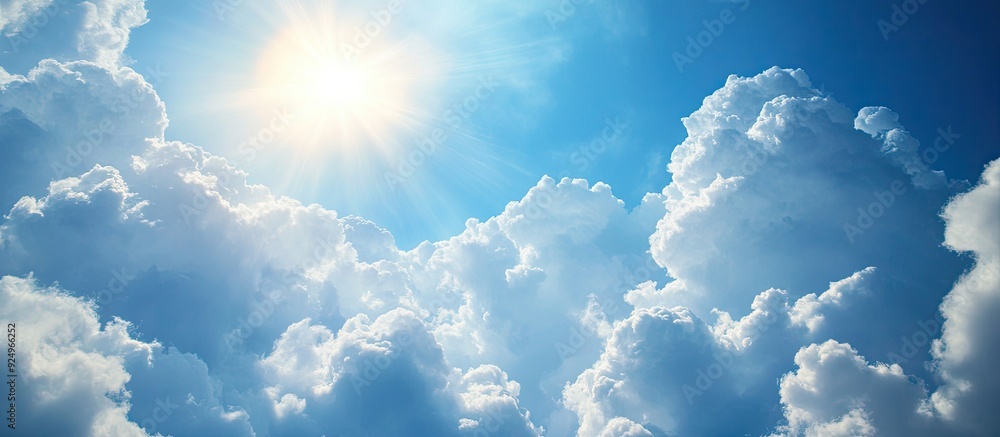 Leinwandbilder fluffy clouds and sunlight in a blue sky. with copy space image. place for adding text or design