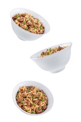 Ground meat spicy ramen noodles in a bowl on a white isolated background