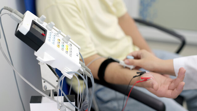 Electromyography for testing patient nerve activity. A modern medical test to detect nerve and muscle issues. Perfect for showcasing professional diagnostics.