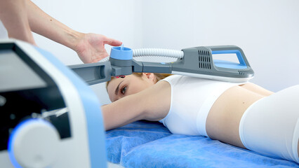 Close-up of a high-inductive magnetotherapy device on a light background. Showcasing advanced...