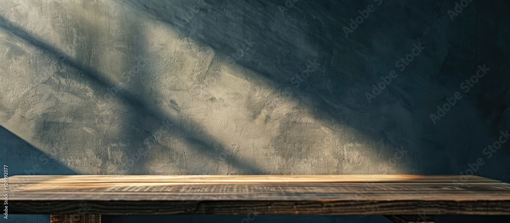 Poster a wooden table is shown against a wall background under soft window lighting creating subtle shadows