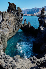 Volcanic rocks at Cueva de la Vaca and the Atlantic Ocean in Santiago del Teide Tenerife Spain © Ovidiu