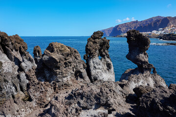 Volcanic rocks at Cueva de la Vaca and the Atlantic Ocean in Santiago del Teide Tenerife Spain