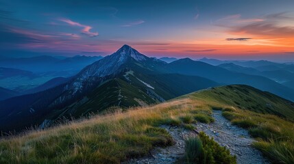 Mountain peak at sunset with dramatic clouds