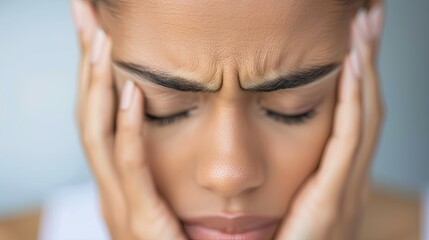 Fototapeta premium Woman Deep in Thought with Puckered Lips and Blurred Background
