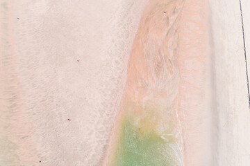 aerial directly above view of a quiet beach at sunrise, summer holidays concept. Background for tourism