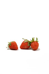 Fresh, ripe strawberries (Fragaria × ananassa) with vibrant red color, photographed against a white background. Perfect for eating fresh or as an ingredient in recipes.