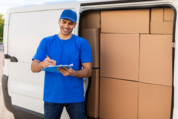 Postal delivery service. Happy man deliverer noting executing of order, guy in uniform checking...