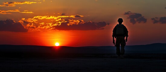 Silhouette of a Soldier at Sunset