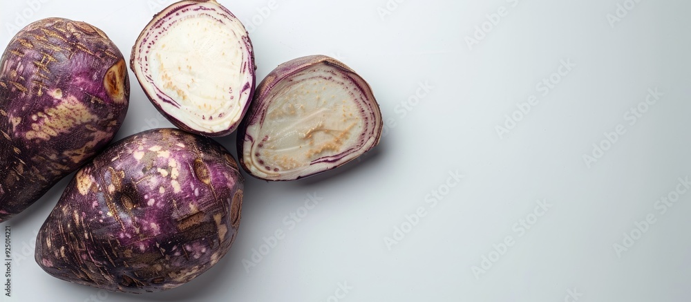 Poster taro displayed on a white backdrop with ample copy space image.