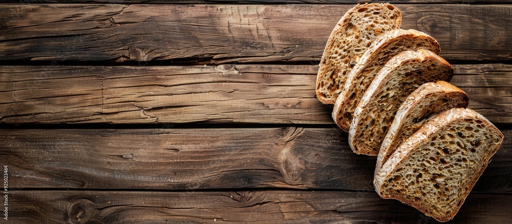 Poster top view of bread slices on an old rustic wooden surface with a horizontal composition and ample cop