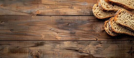 Top view of bread slices on an old rustic wooden surface with a horizontal composition and ample copy space image.