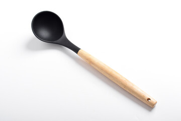 Black silicone kitchen soup ladle isolated on white background. Kitchen utensils