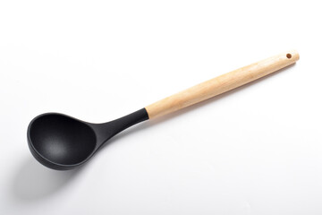 Black silicone kitchen soup ladle isolated on white background. Kitchen utensils